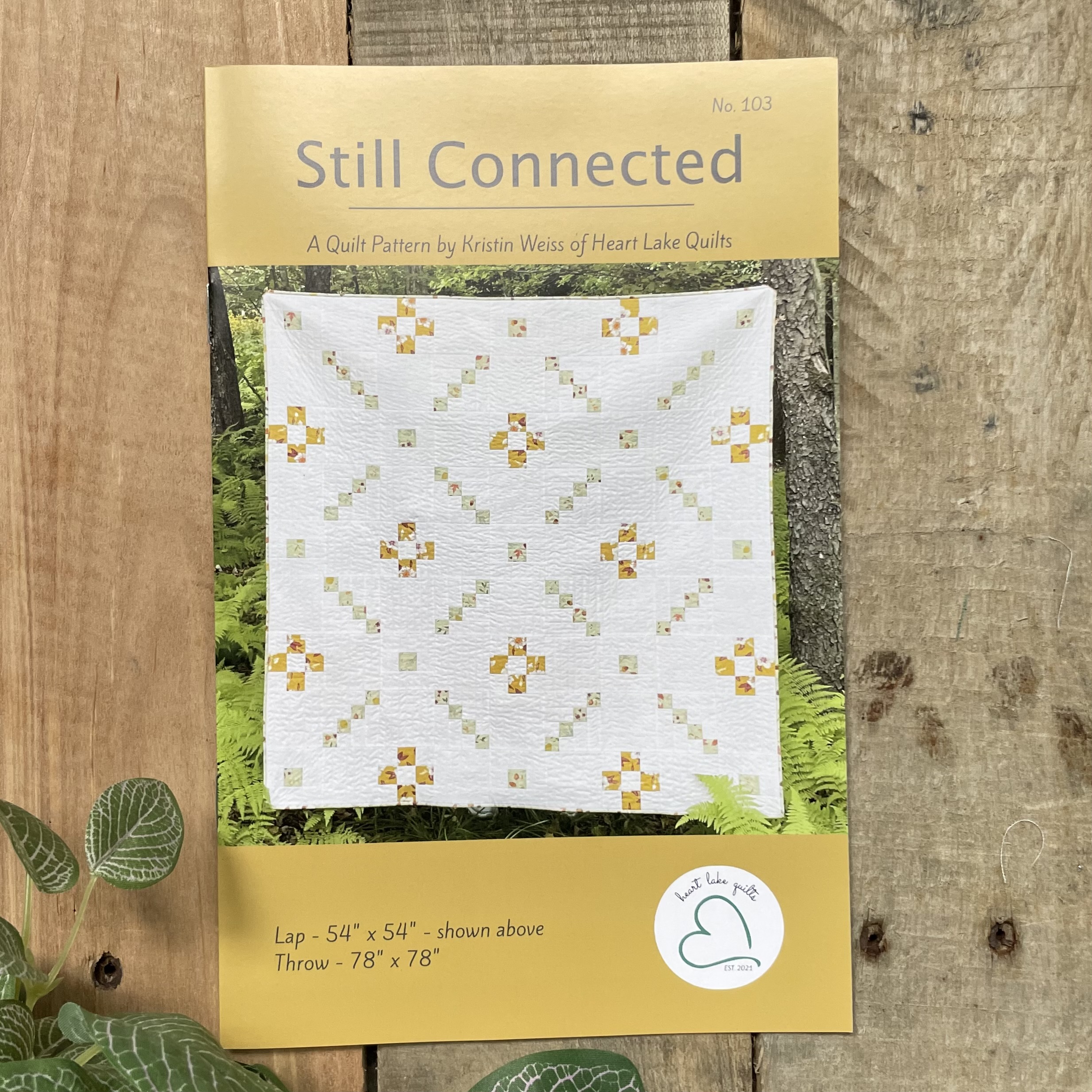 Still Connected quilt pattern poster with white quilt