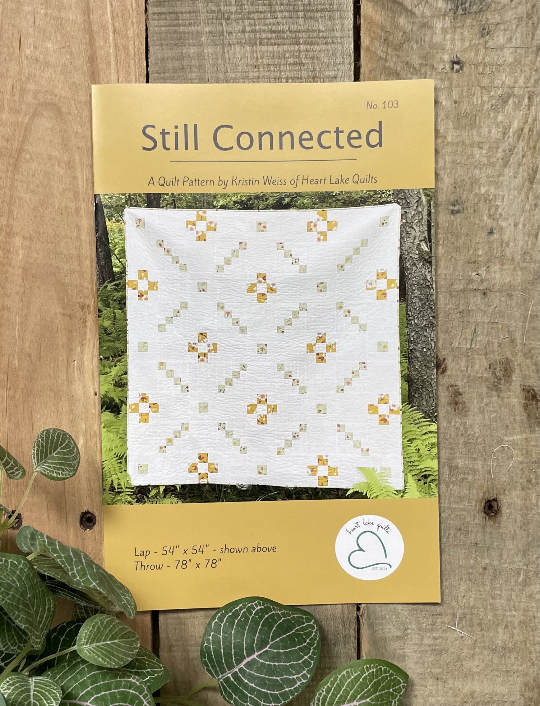 Still Connected quilt pattern cover with floral quilt