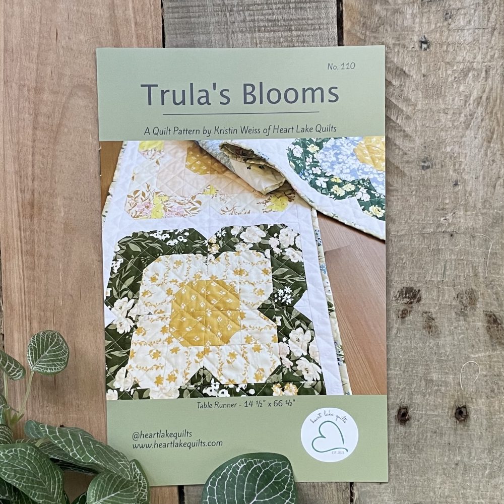 Trula's Blooms quilt pattern cover with floral design