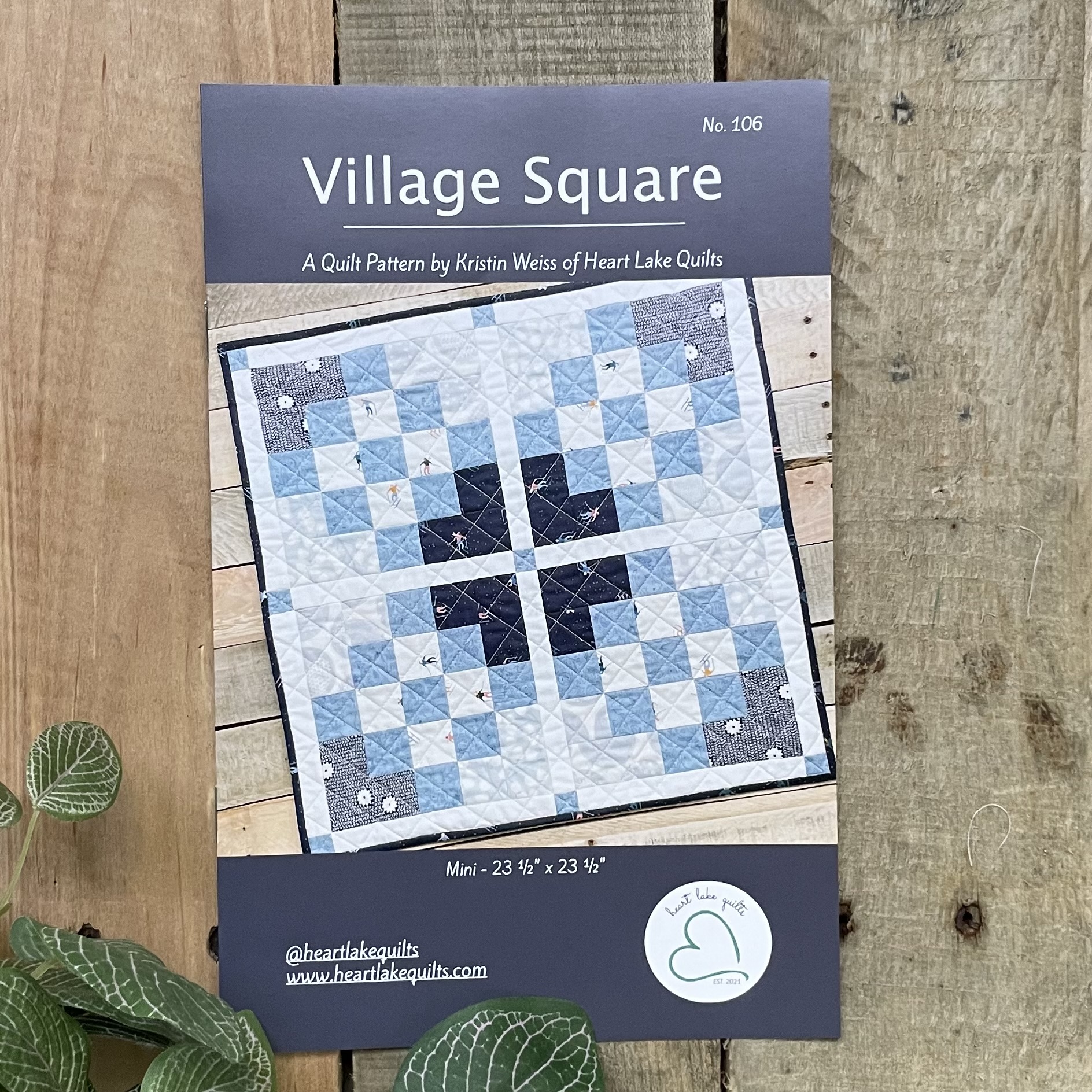 Village Square quilt pattern poster with blue design
