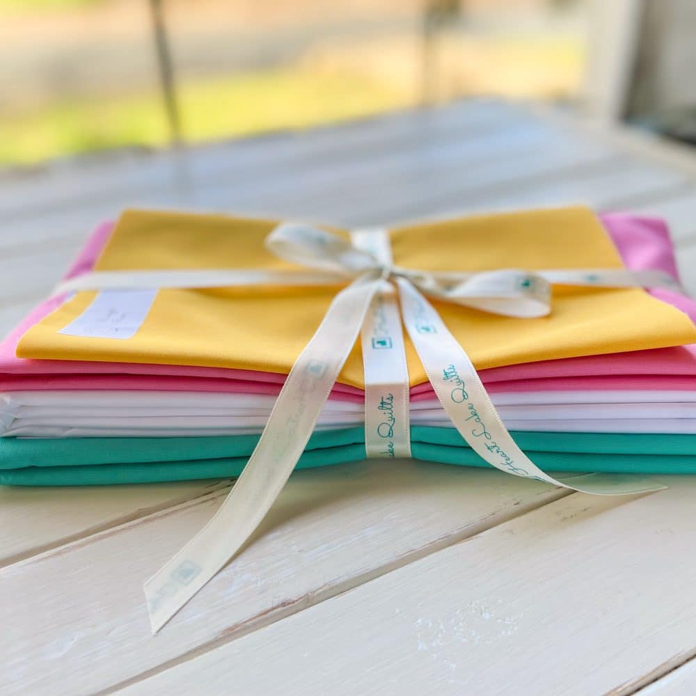 Colorful fabric stack tied with ribbon