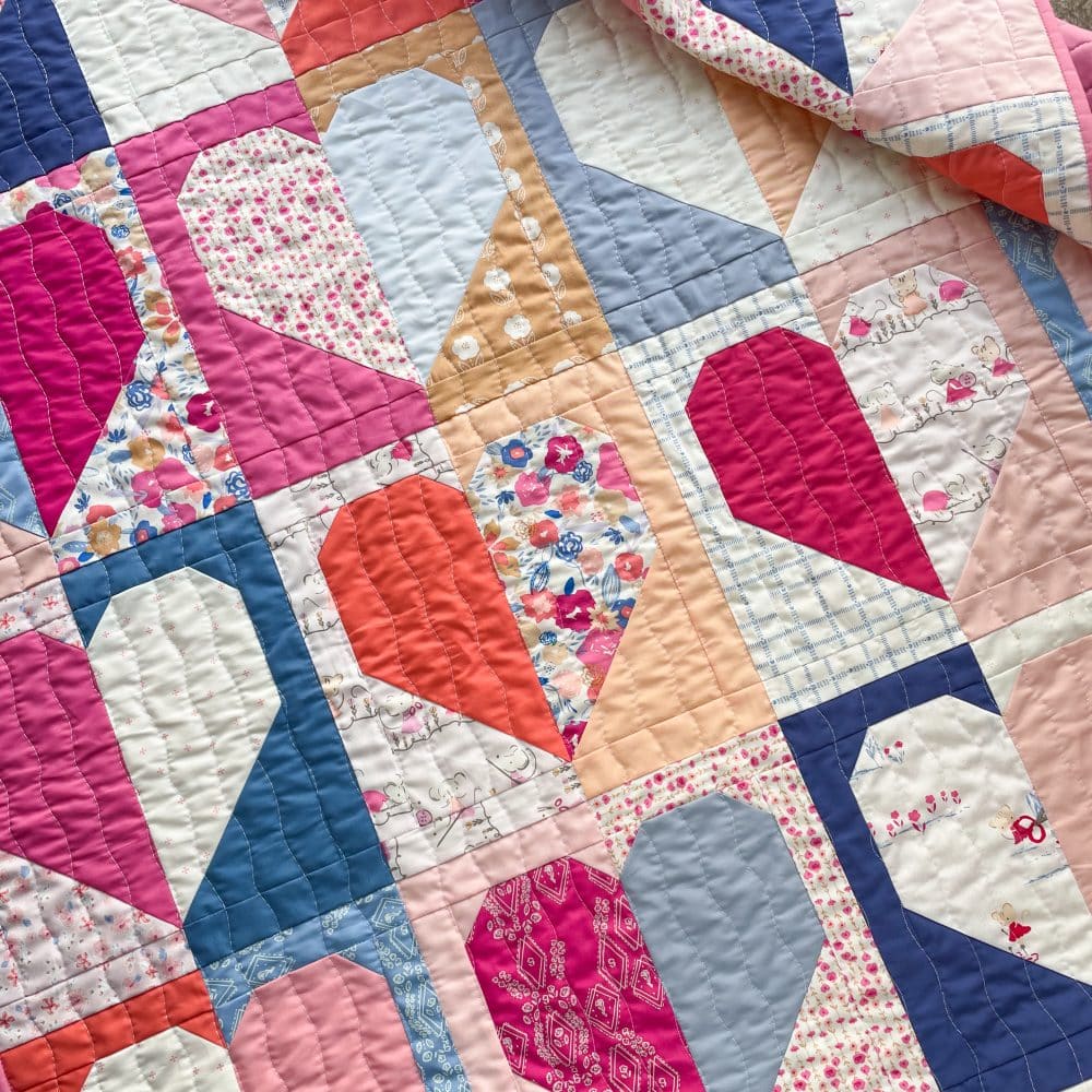 Colorful patchwork quilt with heart patterns