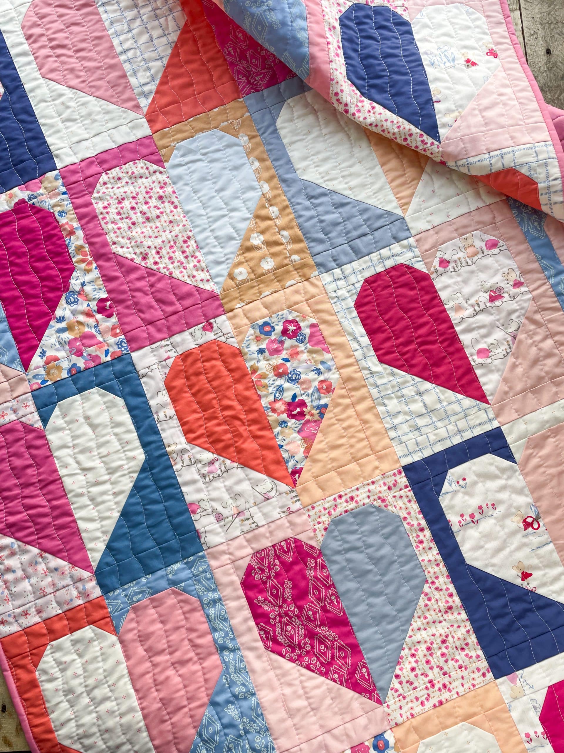 Colorful patchwork quilt with heart patterns