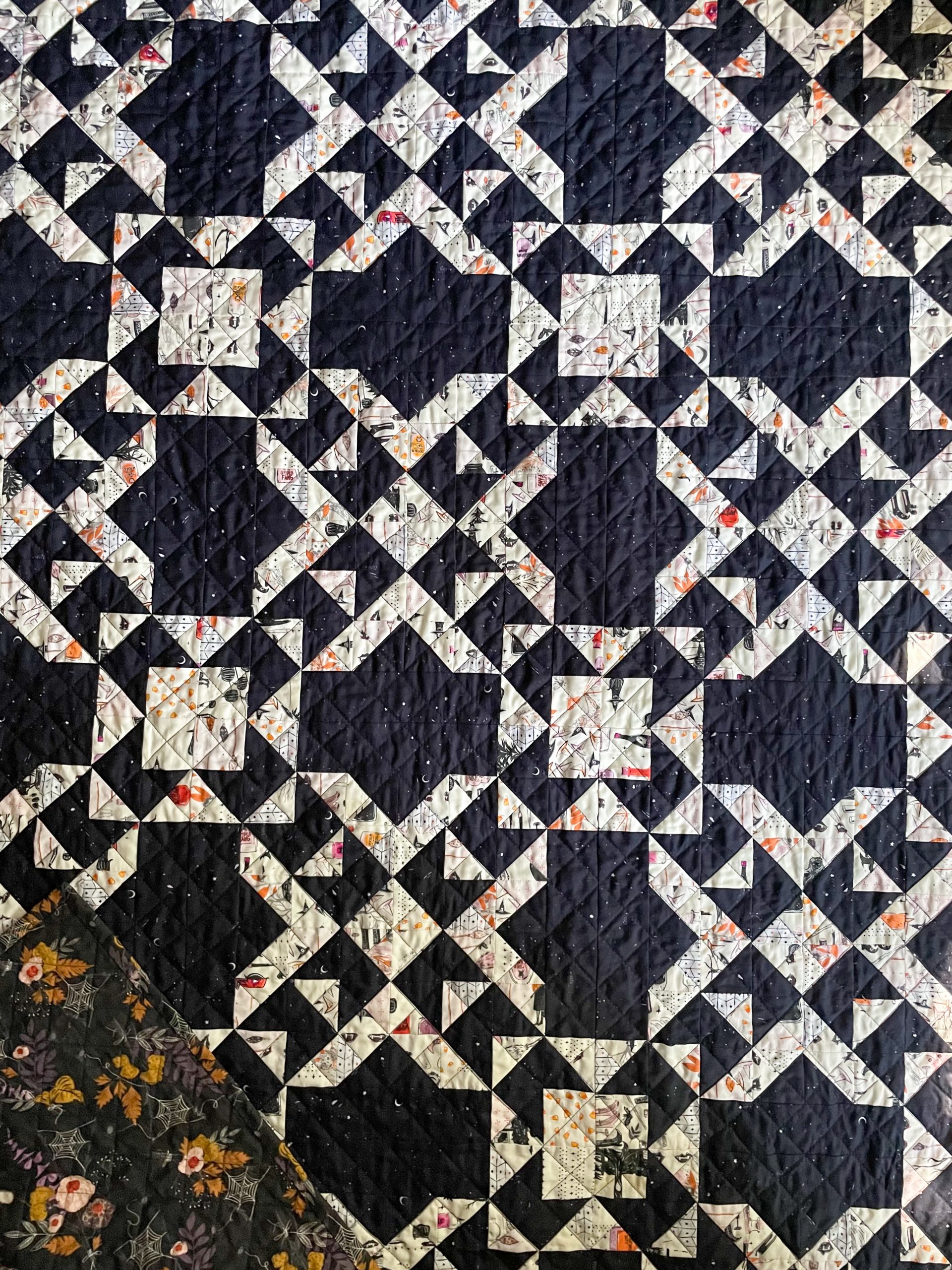 Intricate geometric quilt with floral patterns