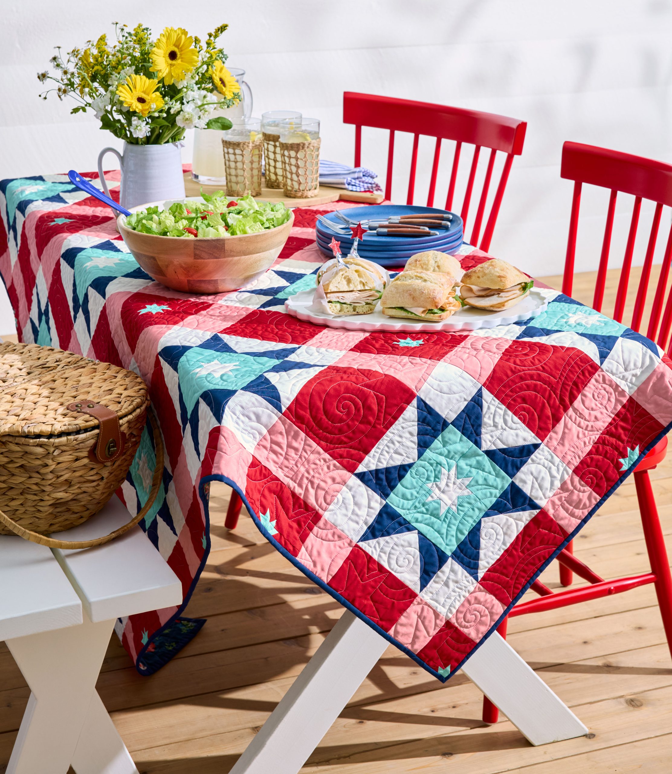 Colorful quilted tablecloth on picnic table