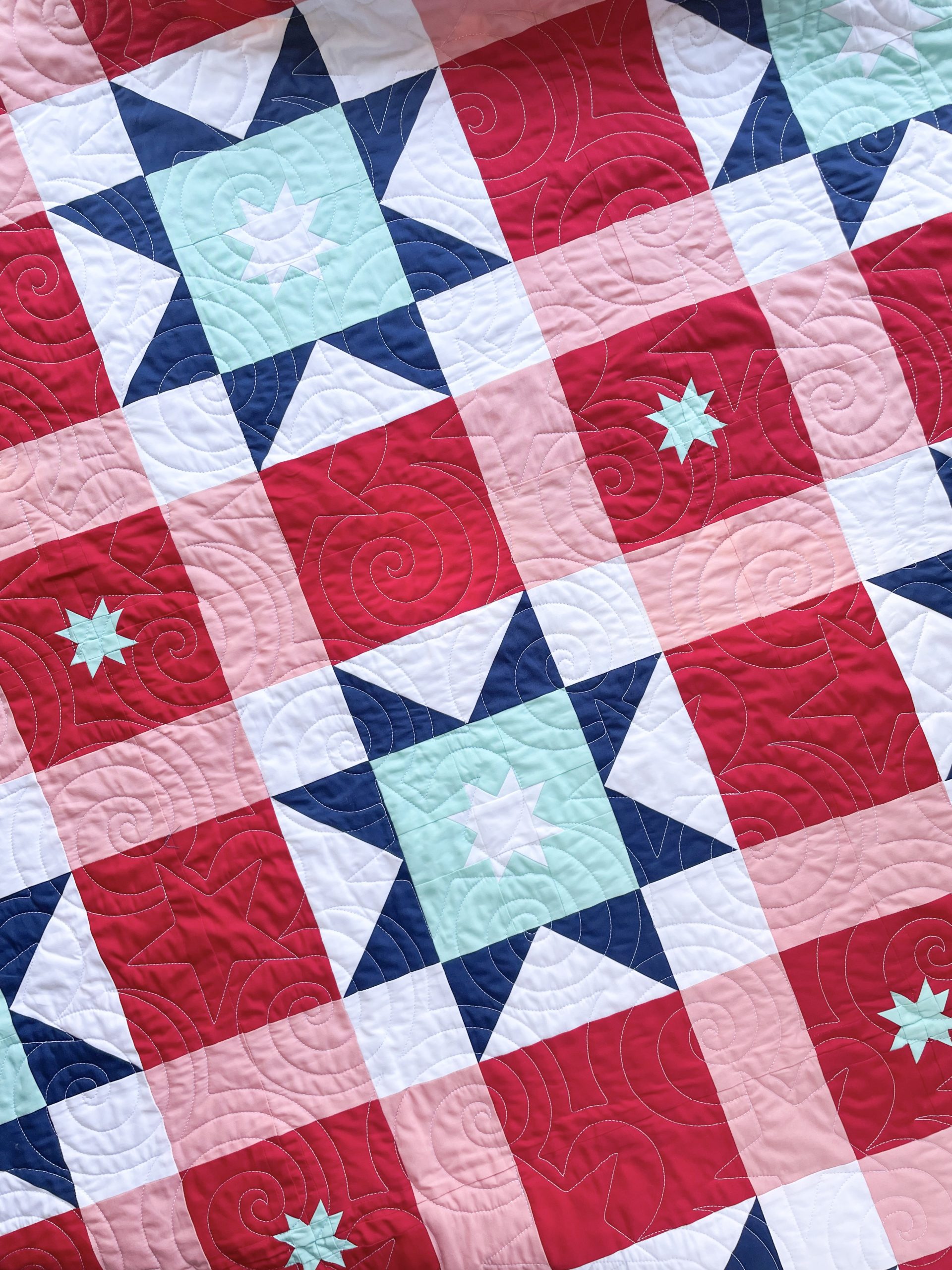 Colorful star-pattern quilt with intricate designs.