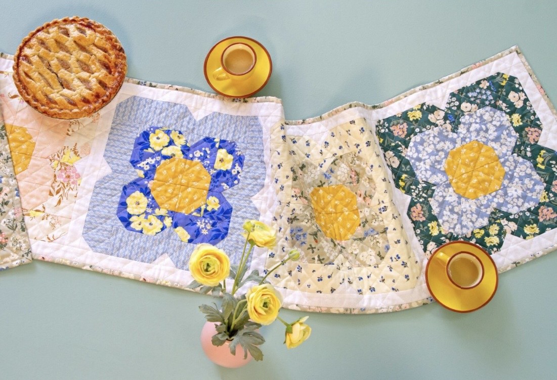 Floral quilt runner with pie and tea cups