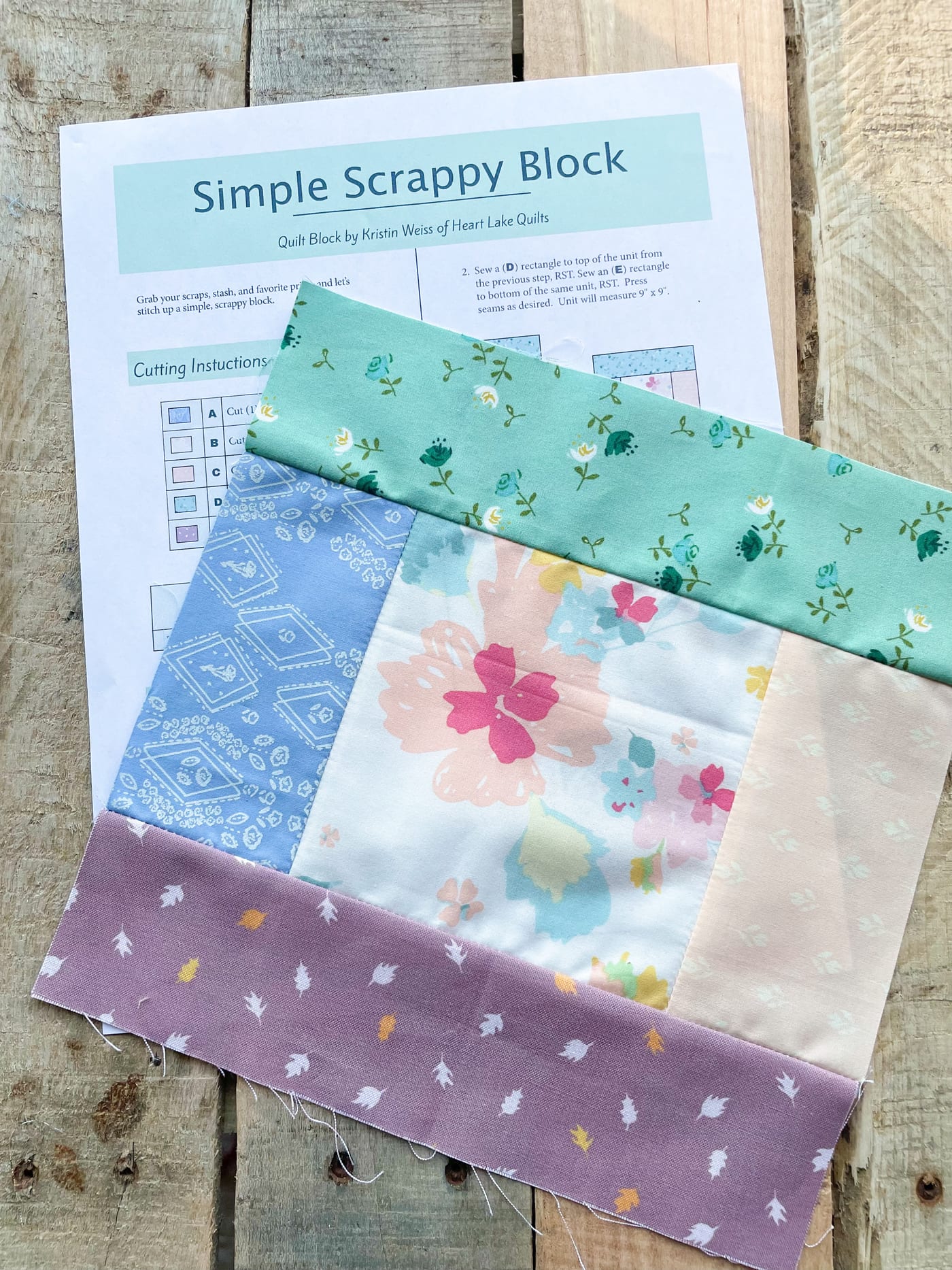 Colorful scrappy quilt block on instruction sheet