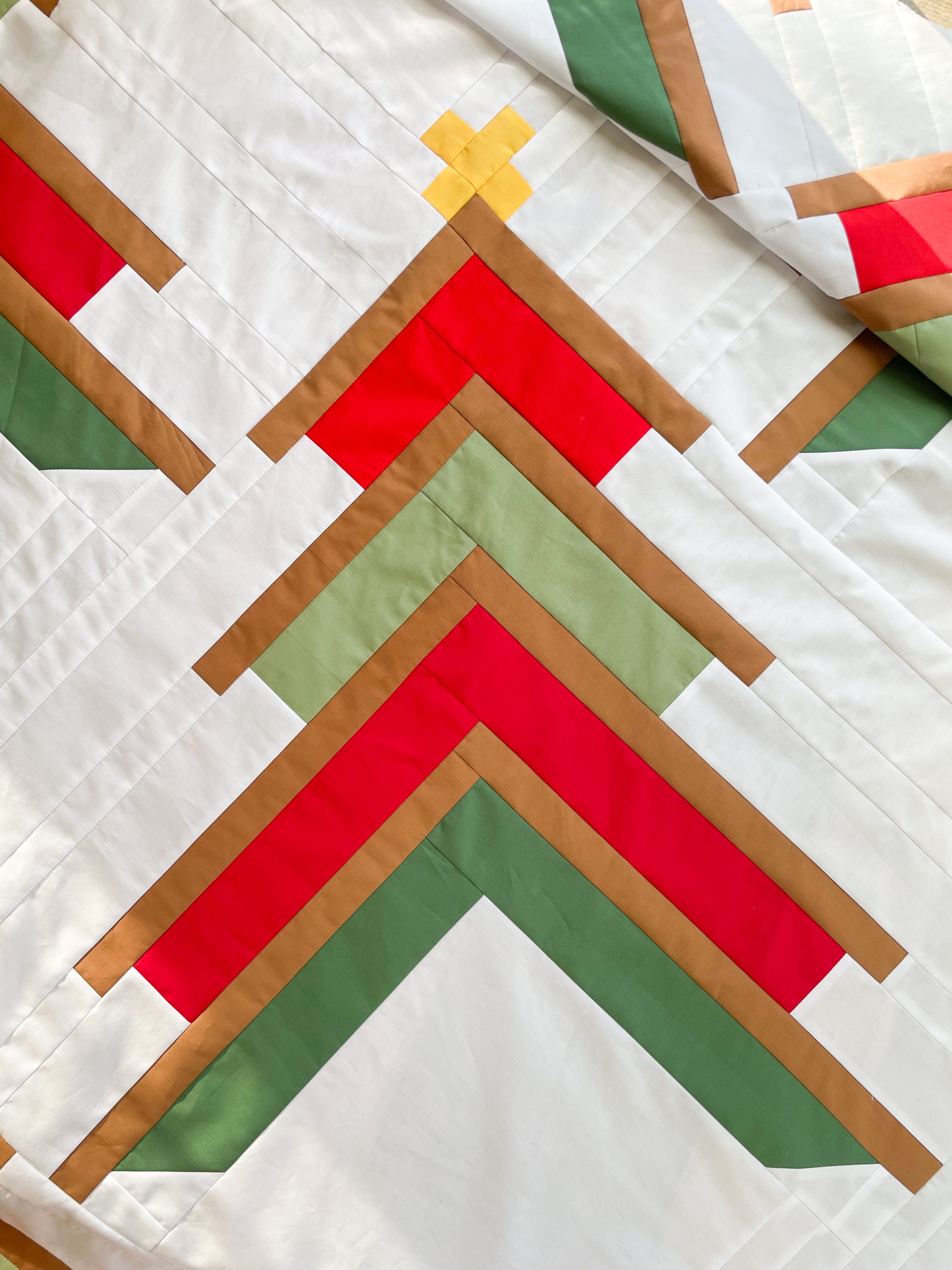 Colorful geometric quilt with chevron pattern