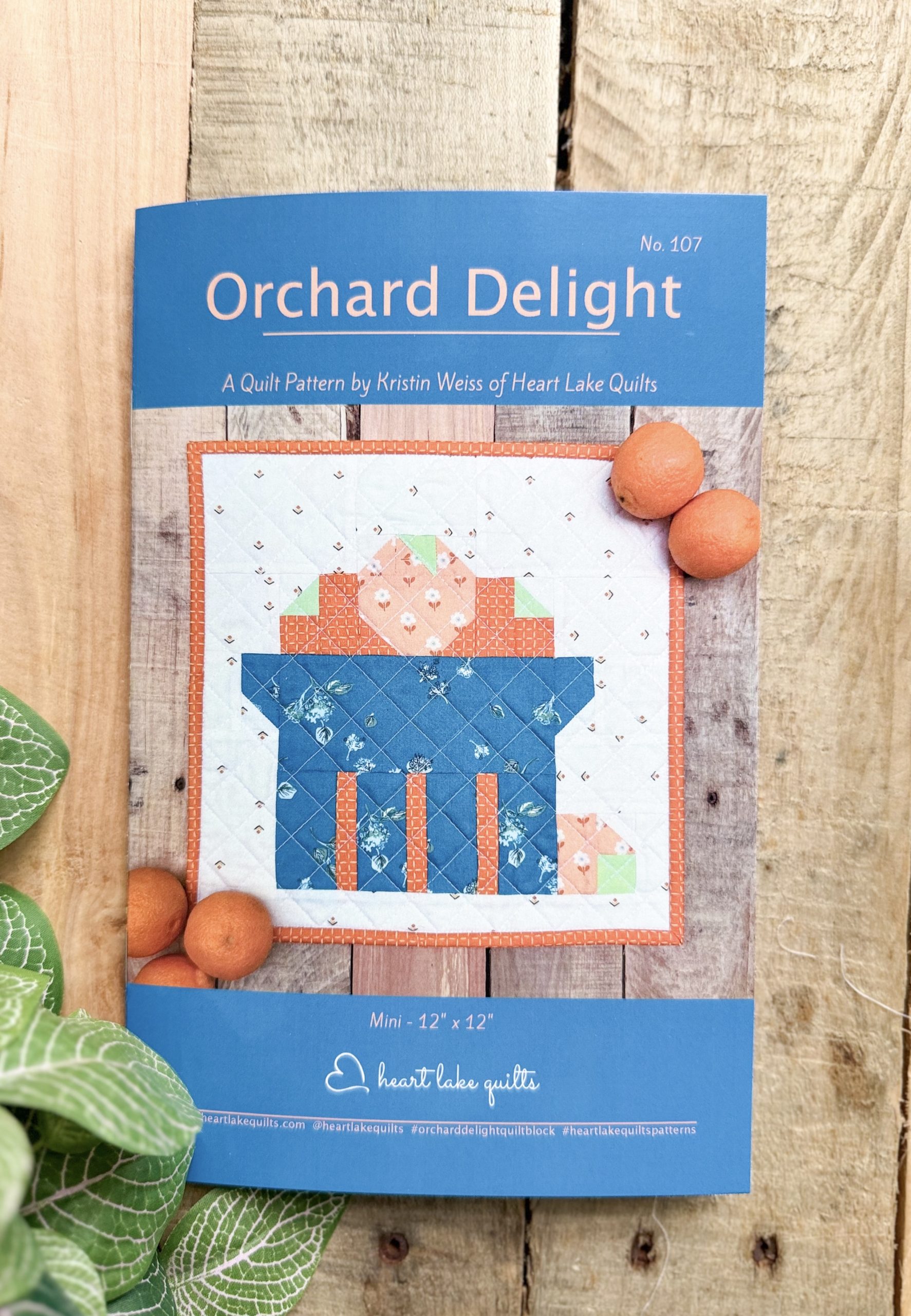 Orchard Delight quilt pattern cover with mini quilt