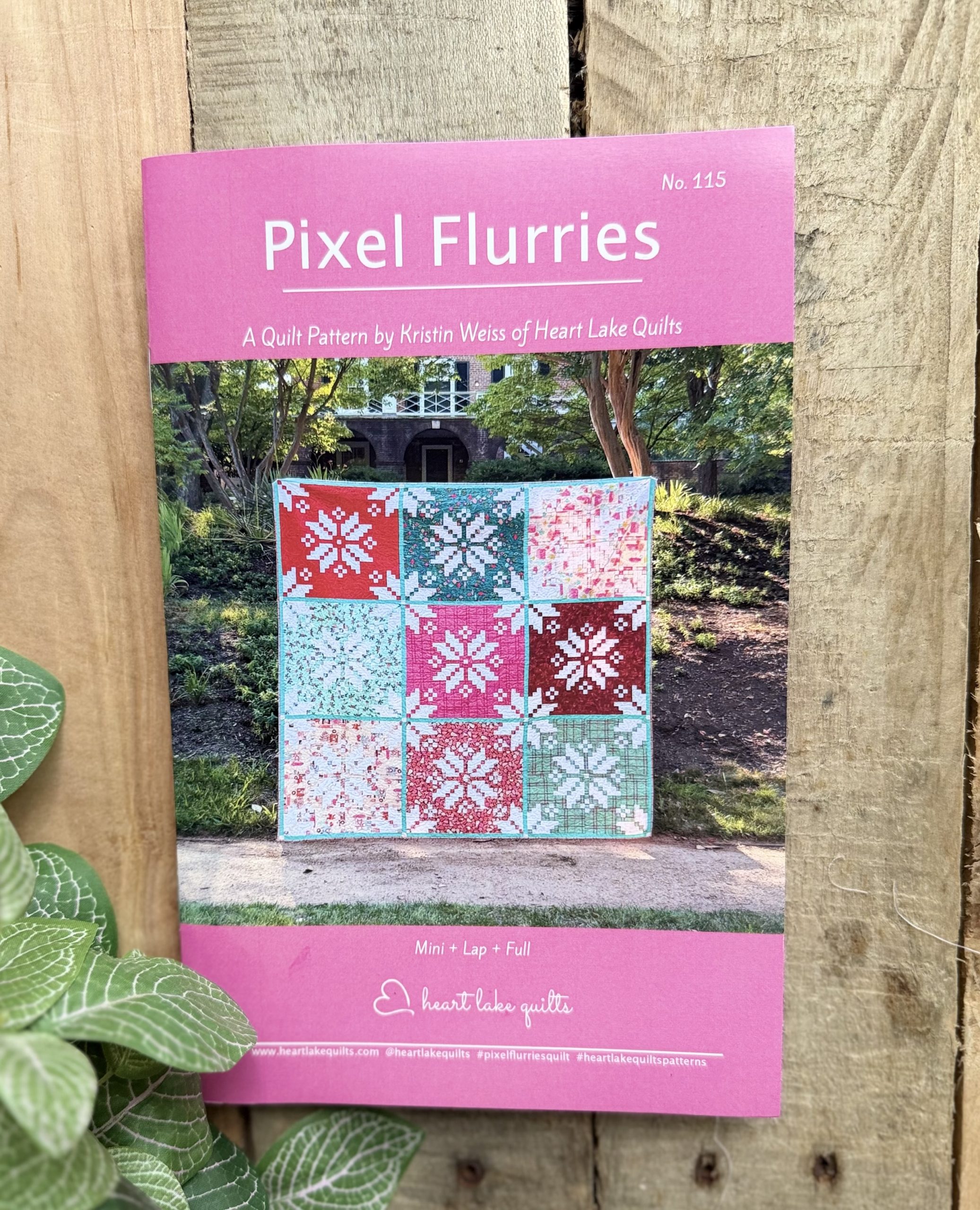 Pixel Flurries quilt pattern cover with snowflake blocks